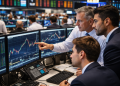 Dow ends higher as chip stocks rally and Fed rate-hike fears ease